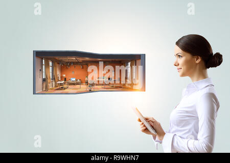 Woman using tablet pc. Mixed media Stock Photo
