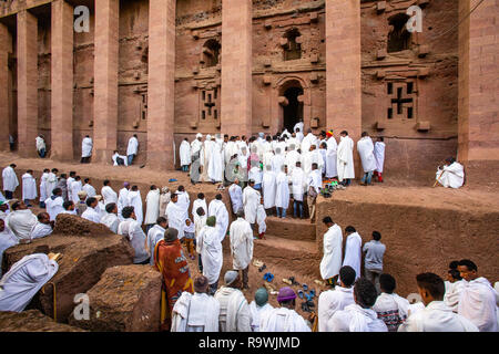 Priests and worshipers during mass at the rock-cut church of House of the Saviour of the World at Lalibela, Ethiopia Stock Photo