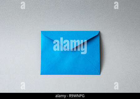 Blue envelope with gray background Stock Photo