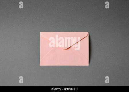 pink envelope with gray background Stock Photo