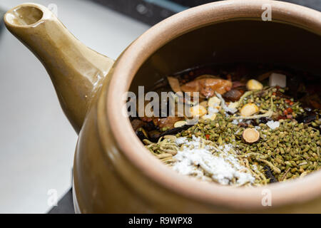 decocting Chinese medicinal herbs with enamel pot Stock Photo