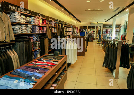 COLOMBO, SRI LANKA - SEPTEMBER 25, 2018:  Wide View of Menswear Clothes, Shirts, Trousers, Jackets with Shelves, Racks and Hangers inside a Fashion Re Stock Photo
