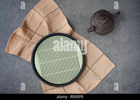 Oriental style teapot and tray. Stock Photo