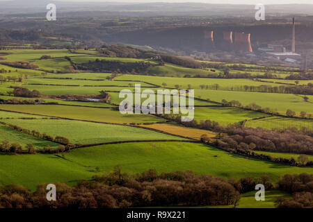 View of Ironbridge Power Station in Shropshire, England, taken from the top of the Wrekin Hill. Green fields, from local farming, in the foreground. Stock Photo