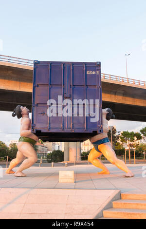 'takes two to tango' sculpture by Scottish artist David Mach of 2  chinese sumo wrestlers lifting a shipping container La Fondation CMA-CGM Marseilles Stock Photo