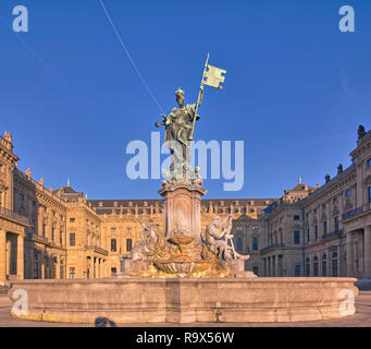 The fountain statue in front of the prince bishop residence of Wurzburg. Symbol of Franconia free state Bavaria Germany. Travel destination summer sun Stock Photo