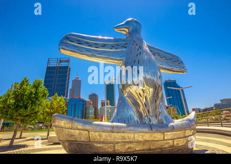 Perth, Western Australia - Jan 3, 2018: First contact bird art sculpture at Elizabeth Quay viewing point on the Swan River. Skyscrapers of Central Business District on background. Blue sky. Stock Photo