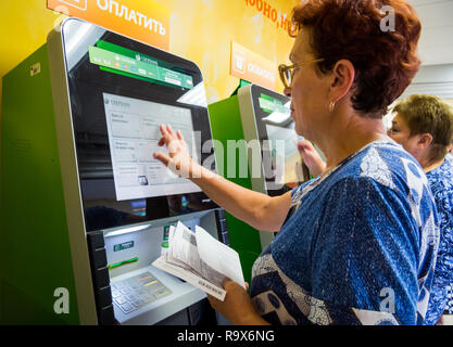 Voronezh, Russia - July 14, 2018: People use terminals to pay for services Stock Photo
