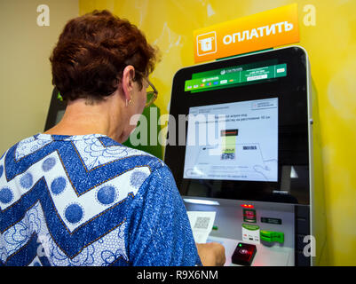 Voronezh, Russia - July 14, 2018: Payment of bills for utilities using the terminal Stock Photo