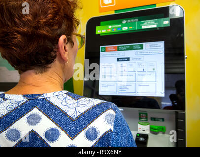 Voronezh, Russia - July 14, 2018: Payment of utility bills using self-service terminal Stock Photo