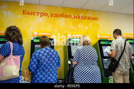 Voronezh, Russia - July 14, 2018: People use express payment terminals of Sberbank of Russia Stock Photo