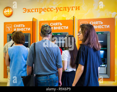 Voronezh, Russia - July 14, 2018: The queue at ATMs and terminals express services Stock Photo