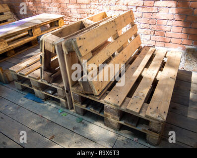 Benches made from old wooden storage pallets Stock Photo