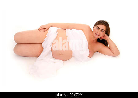 Maternity, baby bump, mum to be relaxing on her side Stock Photo
