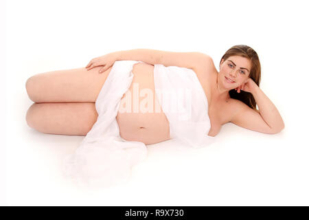 Maternity photo, mum to be relaxing on her side Stock Photo