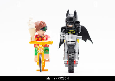 lego robin riding bicycle with radio at his back and holding a ice cream.  Lego minifigures are manufactured by The Lego Group Stock Photo - Alamy