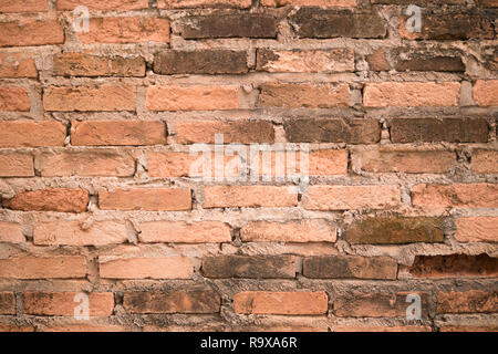 Old orange brick wall textured background. Stock Photo
