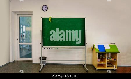 Interior of classroom in the modern school. School board, desks, textbooks. Back to school Stock Photo