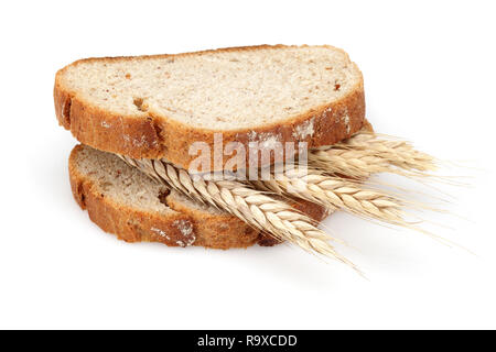 Bread slices with wheat ears in between isolated on white background Stock Photo