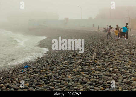 People throwing rocks to the sea of Lima,in Peru Stock Photo