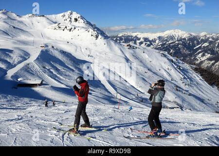 BAD HOFGASTEIN, AUSTRIA - MARCH 9, 2016: People ski in Bad Hofgastein. It is part of Ski Amade, one of largest ski regions in Europe with 760km of ski Stock Photo
