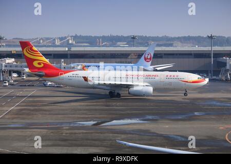 TOKYO, JAPAN - DECEMBER 5, 2016: Hongkong Airlines Airbus A330 taxies at Narita Airport of Tokyo. The airport is the 2nd busiest airport of Japan with Stock Photo