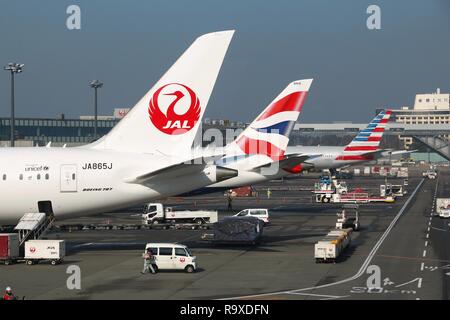 TOKYO, JAPAN - DECEMBER 5, 2016: Japan Airlines, British Airways and American Airlines aircraft are parked at Narita Airport of Tokyo. The airport is  Stock Photo