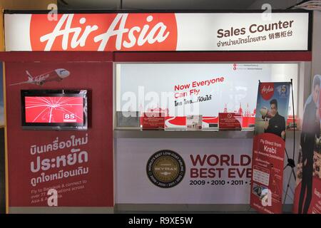 TRANG, THAILAND - DECEMBER 21, 2013: Air Asia ticket counter at Trang Airport in Thailand. Air Asia group flies 169 aircraft to 121 destinations. AirA Stock Photo