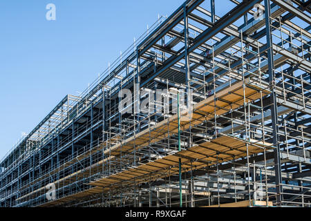 Scaffolding platform on a steel girder framework for a new building on a construction site, Nottingham, England, UK Stock Photo