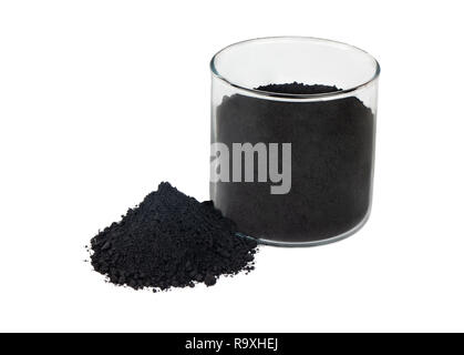 Black powder activated charcoal in glass on white background Stock Photo