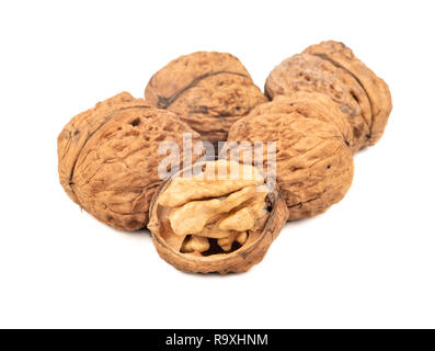 Several large walnuts with a half on a white background Stock Photo