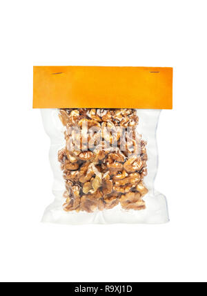 Dry walnuts without shell in vacuum package on white background Stock Photo