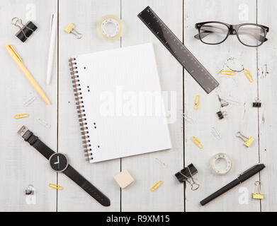 workplace with notepad, glasses, watch, pen etc. top view Stock Photo