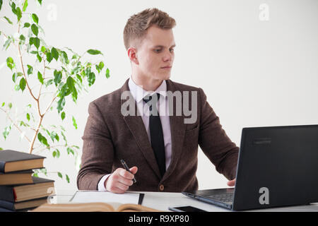 a man works in the Office at the computer business clerk  Stock Photo