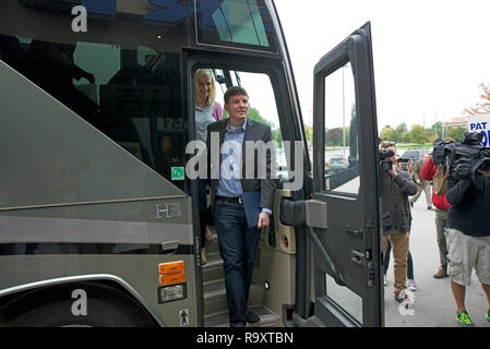 Overland Park, Kansas, USA, October 12, 2014 Cory Bliss, Senator Roberts campaign manager steps off the bus at campaign stop at Robert's office in Overland Park Stock Photo