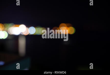Aligned colorful defocused lights blurred for editing with a black background. Stock Photo