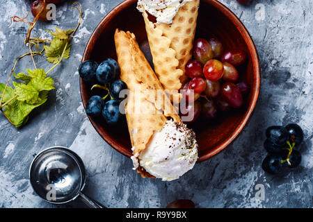 Ice cream cone vanilla and grape flavor.Ice cream in a waffles Stock Photo
