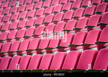 empty red chairs lined up in the old classrooms Stock Photo