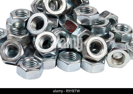 Chromed screw nuts from above. Screw nuts of different sizes on a gray background. Stock Photo