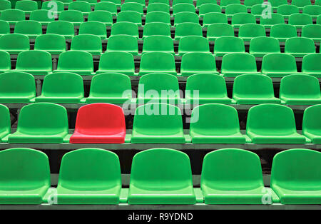 Background of empty seats in a stadium with one special Stock Photo