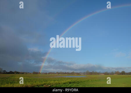 rainbow over winter fields in Shropshire, UK Stock Photo