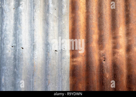 Close up old  rusty galvanized zinc sheet background. Stock Photo