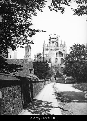 Late Victorian black and white photograph of Ely Cathedral in Cambridgeshire, England.The cathedral has its origins in AD 672 when St Etheldreda built an abbey church. The present building dates back to 1083, and cathedral status was granted it in 1109. Until the Reformation it was the Church of St Etheldreda and St Peter, at which point it was refounded as the Cathedral Church of the Holy and Undivided Trinity of Ely, continuing as the principal church of the Diocese of Ely, in Cambridgeshire. Stock Photo