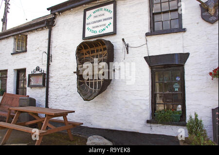 The White Hart Free house - pub in Cenarth, Carmarthenshire Wales, with old Coracle suspended on the wall. Stock Photo