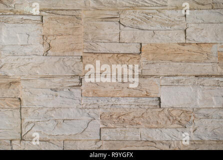 Texture of brown stone - granite tile on wall Stock Photo