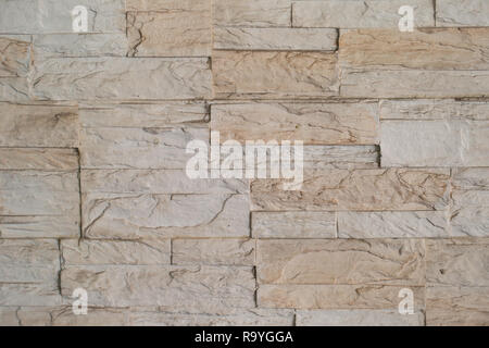 Texture of brown stone - granite tile on wall Stock Photo