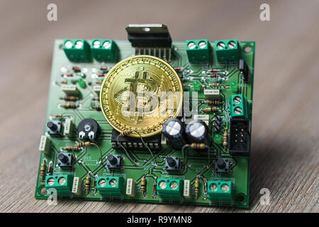 Photo of Bitcoin or Bitcoin cash on electronic circuit, computer part Stock Photo