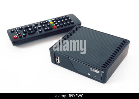 Android Television set top box receiver with remote controller isolated on white, smart TV accessory Stock Photo