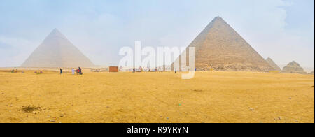 GIZA, EGYPT - DECEMBER 20, 2017: Pyramids of Giza are the center of tourist life and the must see place in Egypt, on December 20 in Giza Stock Photo