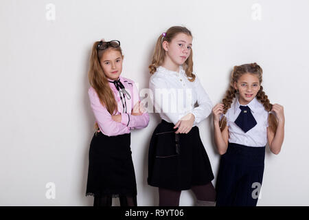 three girls at school boards in the classroom lesson  Stock Photo